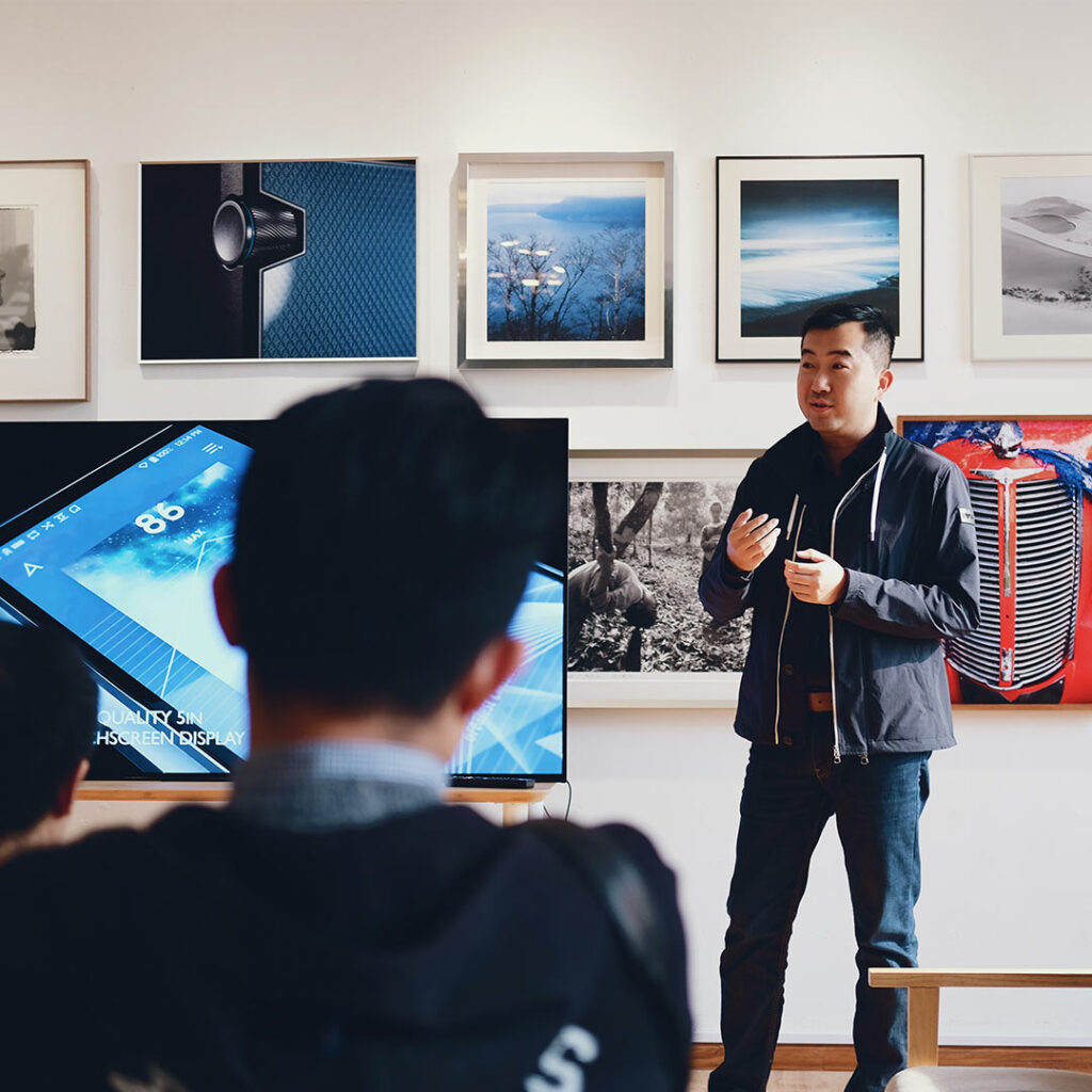 Photo by 祝 鹤槐: https://www.pexels.com/photo/man-beside-flat-screen-television-with-photos-background-716276/
